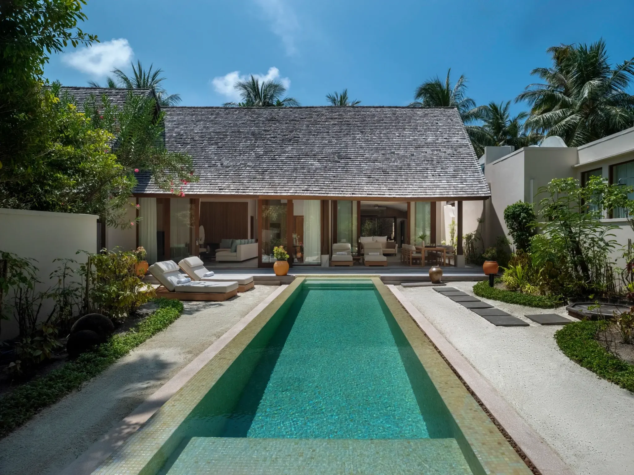 Beach villa with private pool at sunset